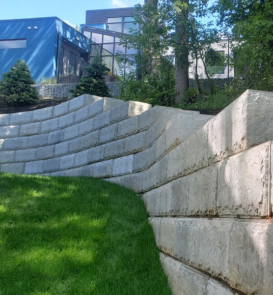 Oversized Precast Concrete Inexpensive Retaining Wall Ideas In Sloped And Circular Backyard