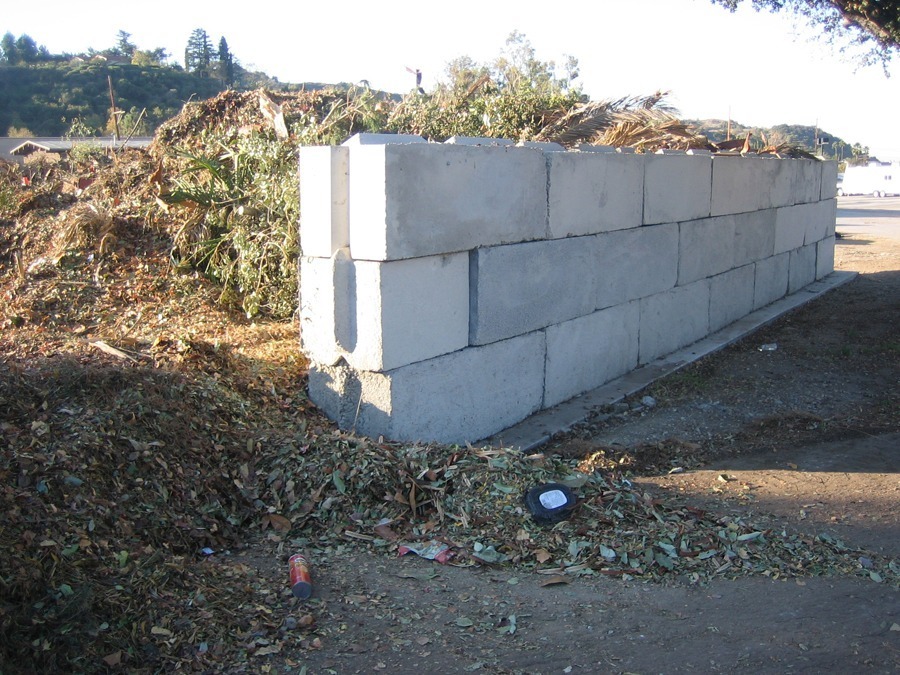waste concrete inexpensive retaining wall ideas in large backyard